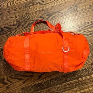 Brand New Dare to Roam Orange Duffel Bag